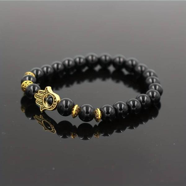 Hamsa Hand Armband Set aus schwarzen Perlen mit Metallanhänger in Gold, 3 Stück Hamsa Hand Armband Set aus schwarzen Perlen mit Metallanhänger in Gold, 3 Stück